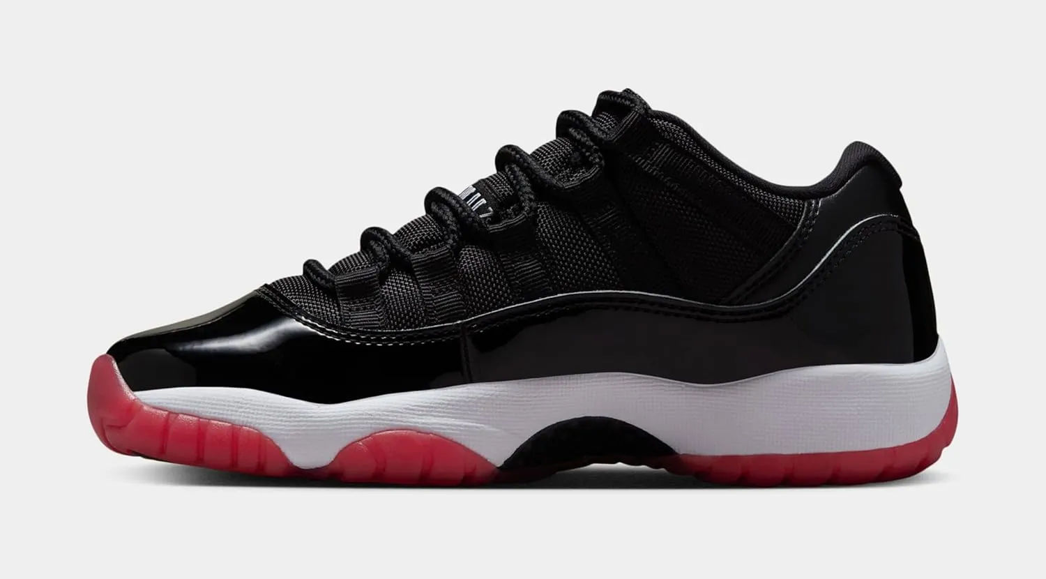 Air Jordan 11 Retro Low Bred Grade School Lifestyle Shoes (Black/Red/White)